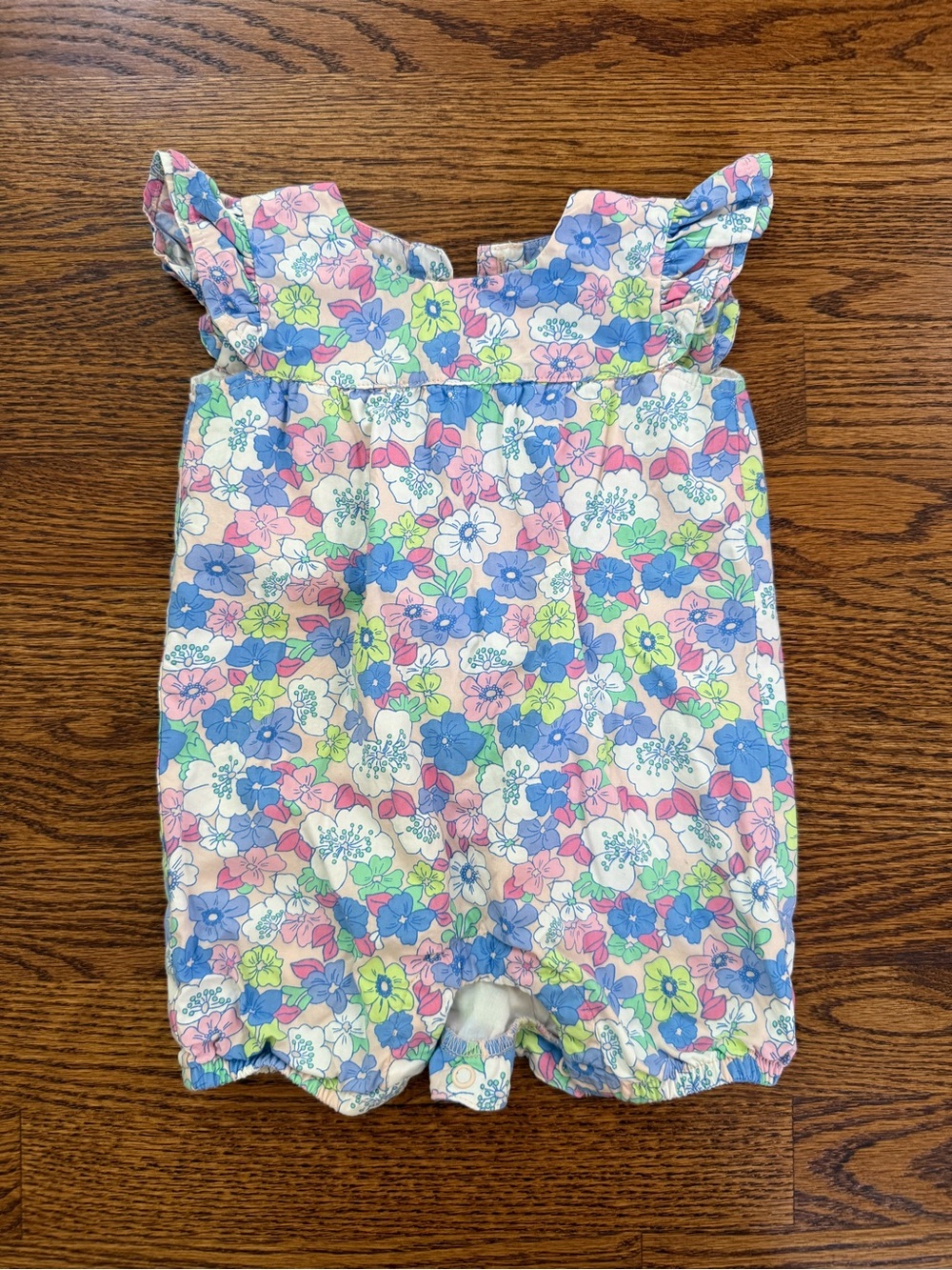 Floral Ruffle-Sleeve Baby Romper in Pastel Multicolor